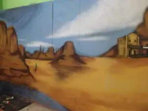 Graffiti: Escenografía viejo oeste sobre cartón