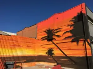 Mural decorativo con un atardecer en la playa
