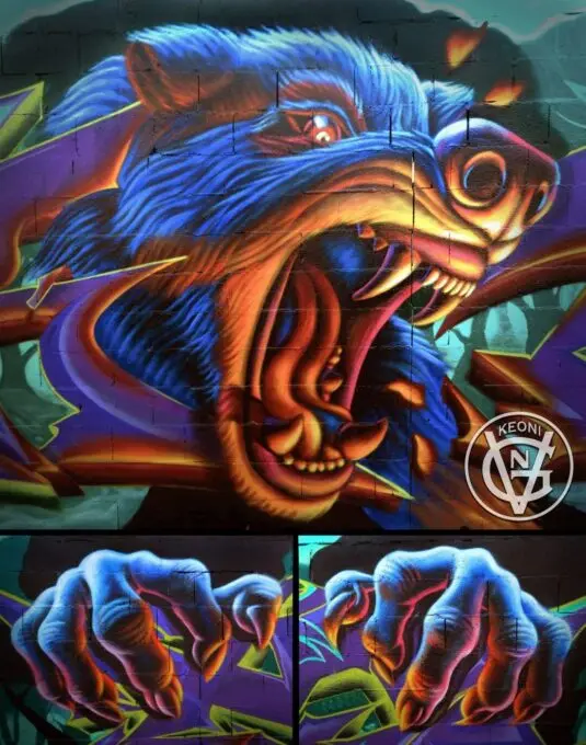 Mural figurativo de lobo en escorzo.
